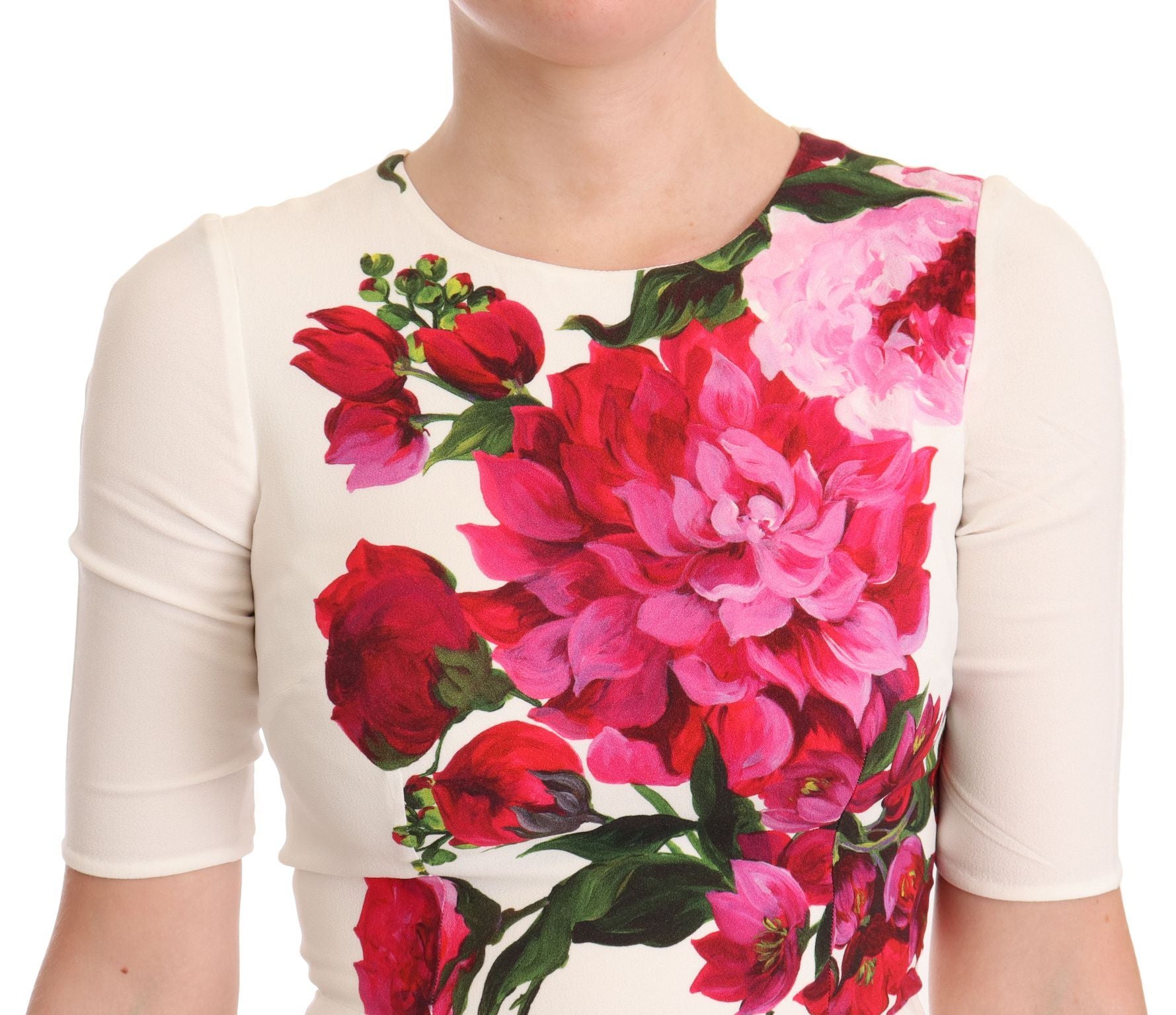 A white midi dress with a floral print featuring red and pink flowers