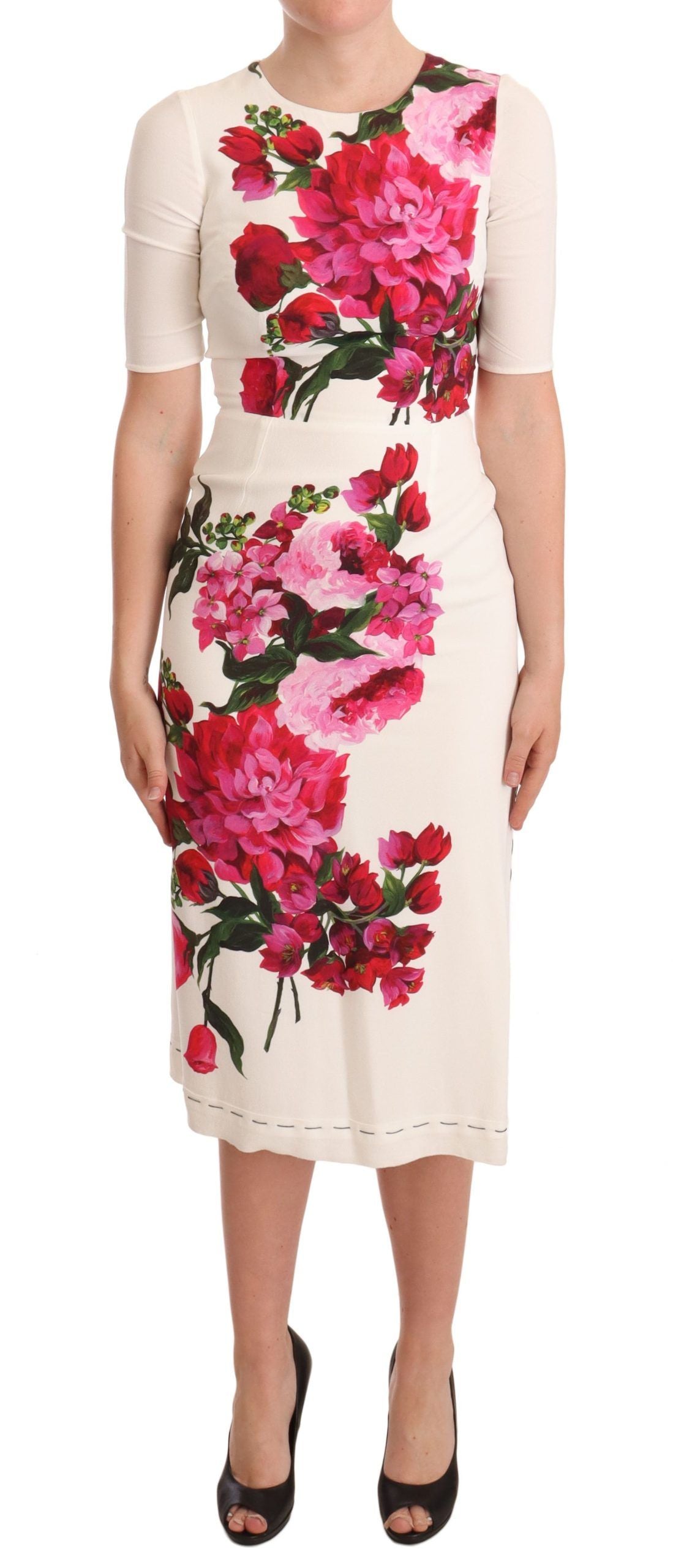 A white midi dress with floral print and slit on the side