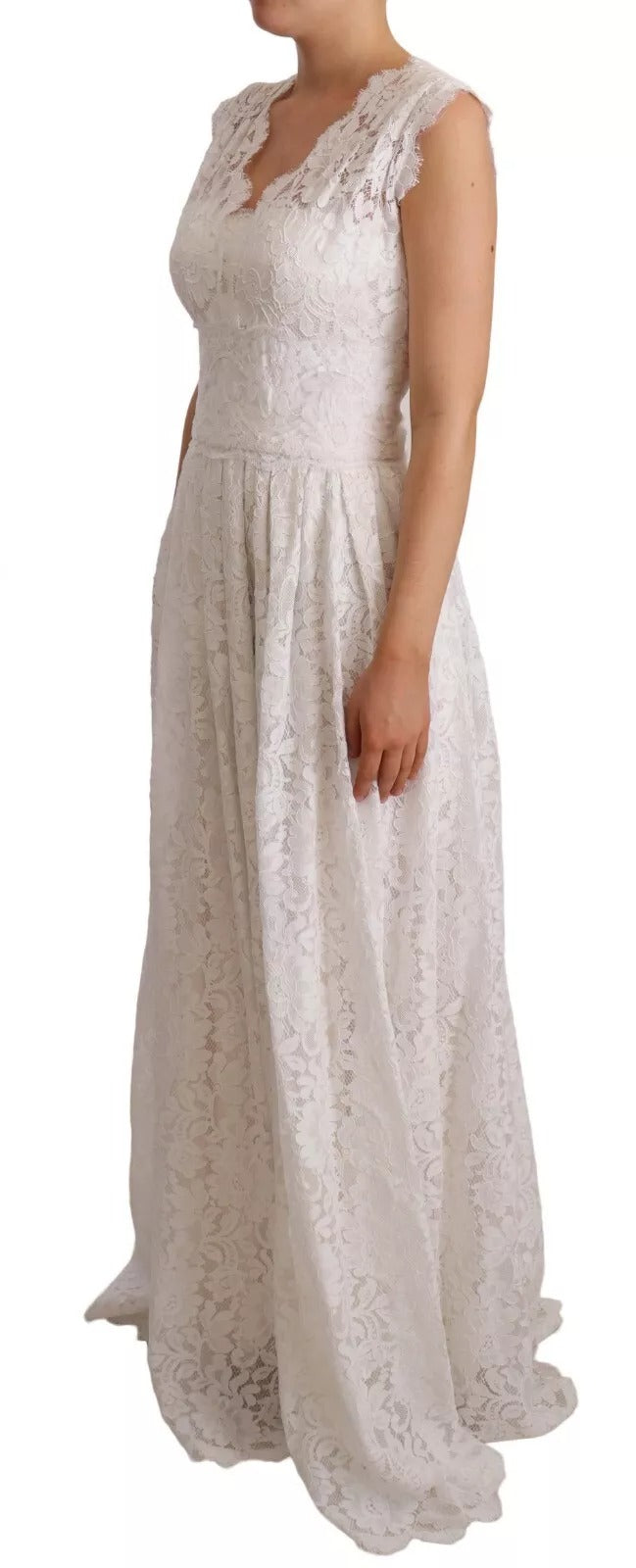 A long white lace dress with floral embroidery, featuring a sleeveless design and a flowing skirt