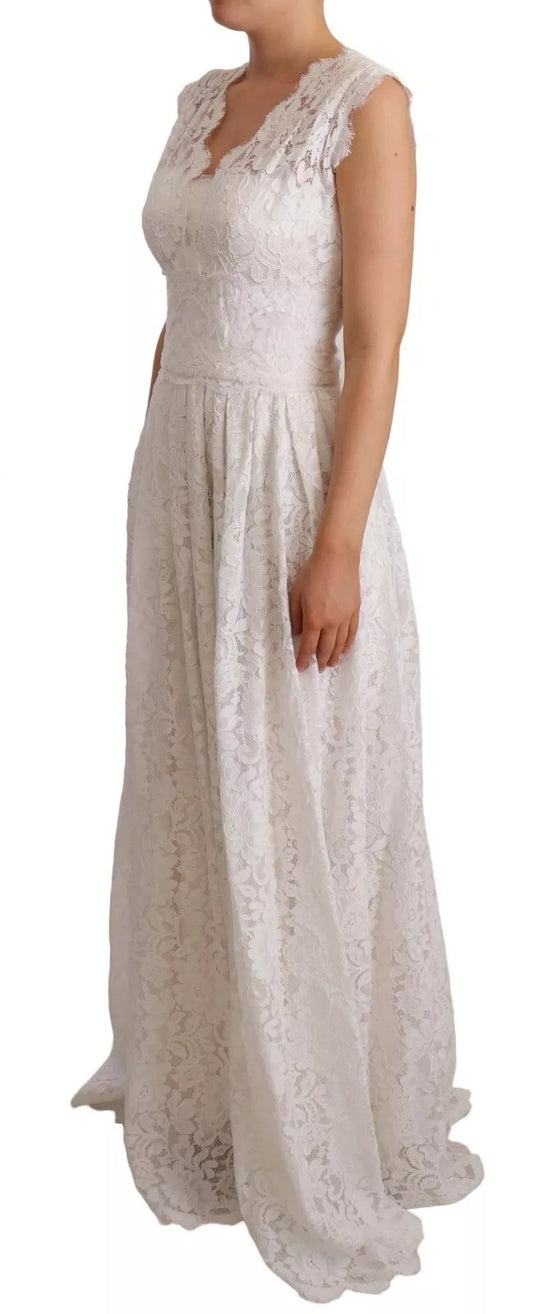 A long white lace dress with floral embroidery, featuring a sleeveless design and a flowing skirt