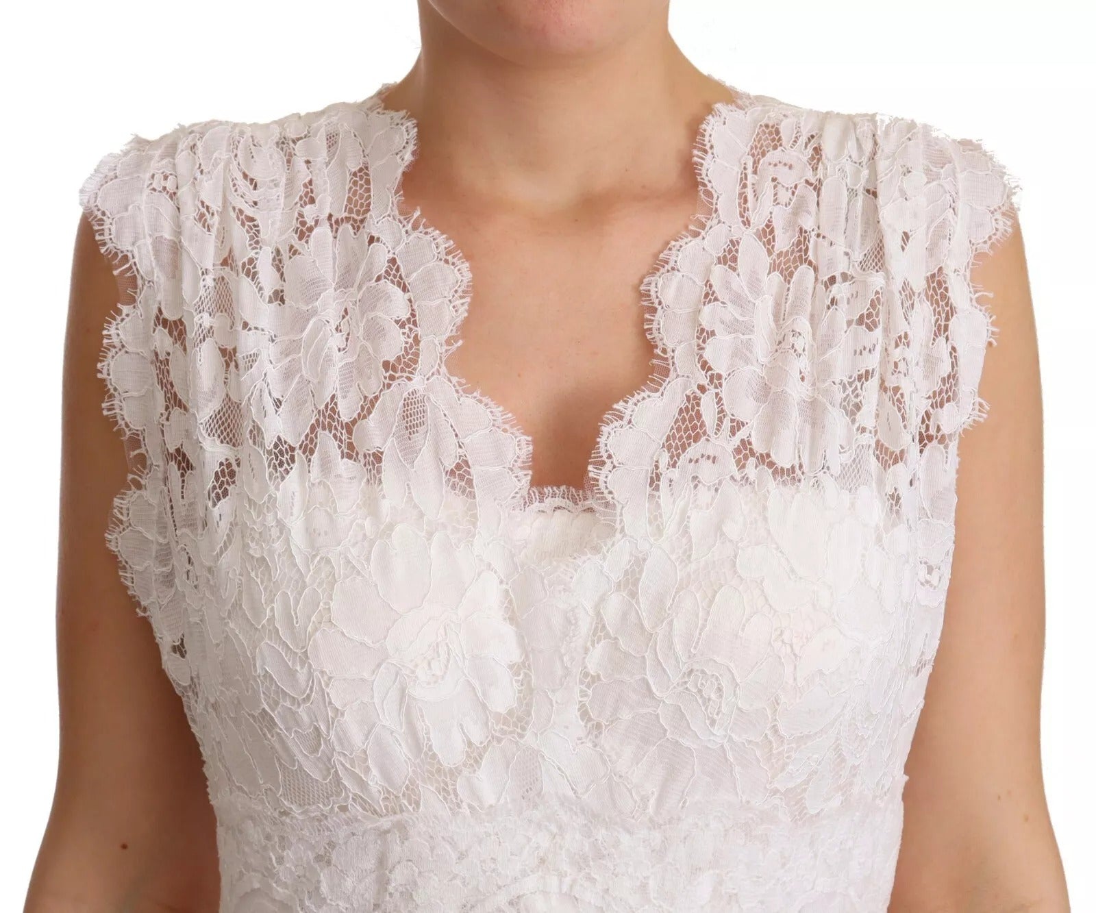 A white lace dress with floral embroidery and long sleeves