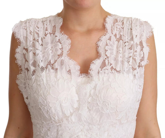 A white lace dress with floral embroidery and long sleeves