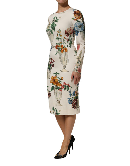 A midi dress with a floral pattern and vase design on the front, from the brand Dolce & Gabbana