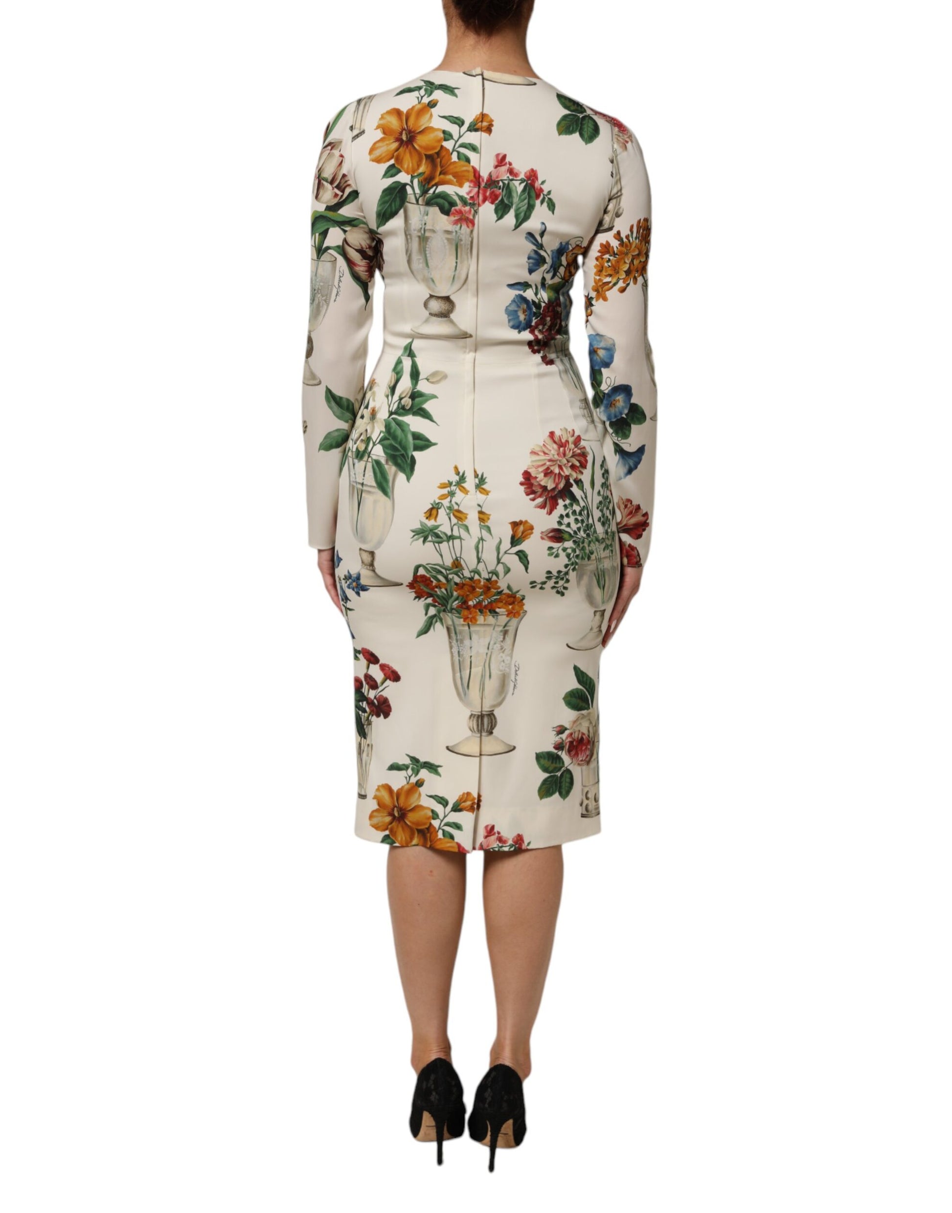 A midi dress with a floral pattern and vase silhouette on the back