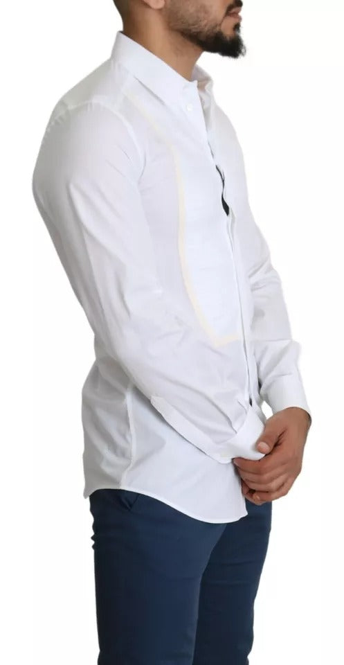 A mannequin wearing a white formal tuxedo dress with gold shirt
