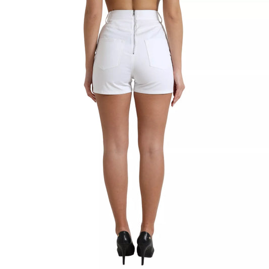 Woman wearing white shorts and black heels