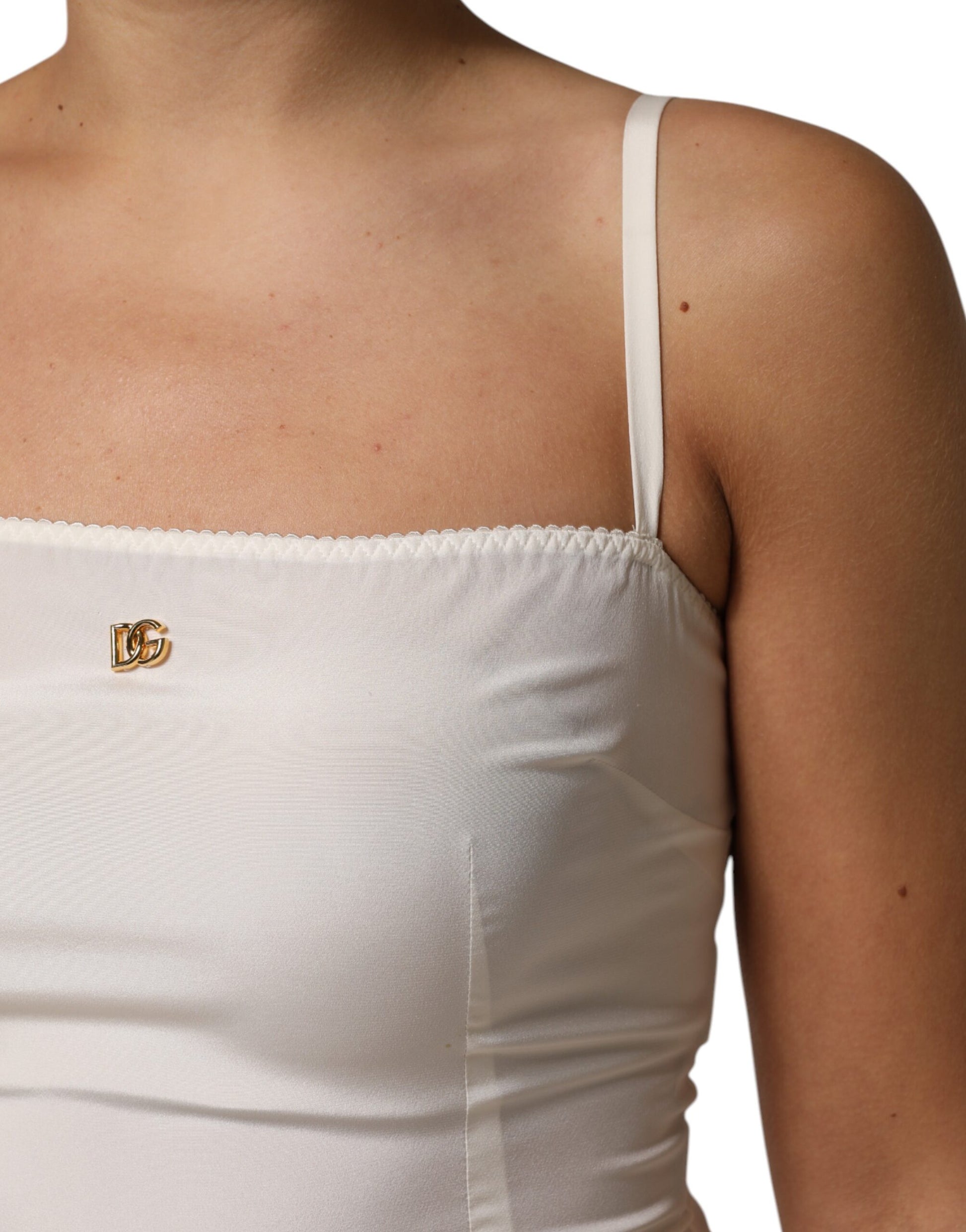 A white full slip dress with a D&G logo on the chest