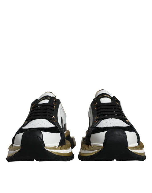 Pair of black and white sneakers with gold accents