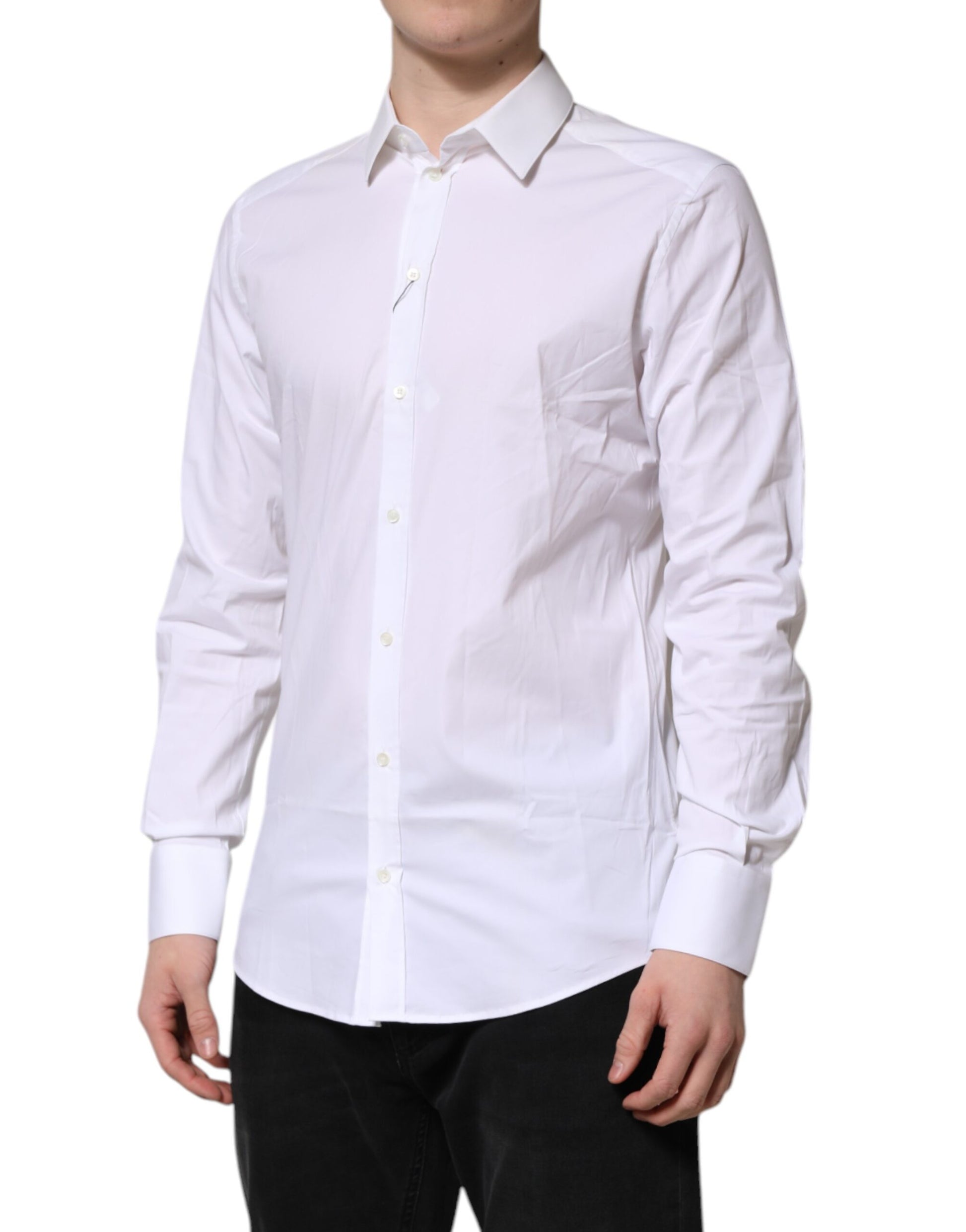A long-sleeved white collared dress shirt with gold accents