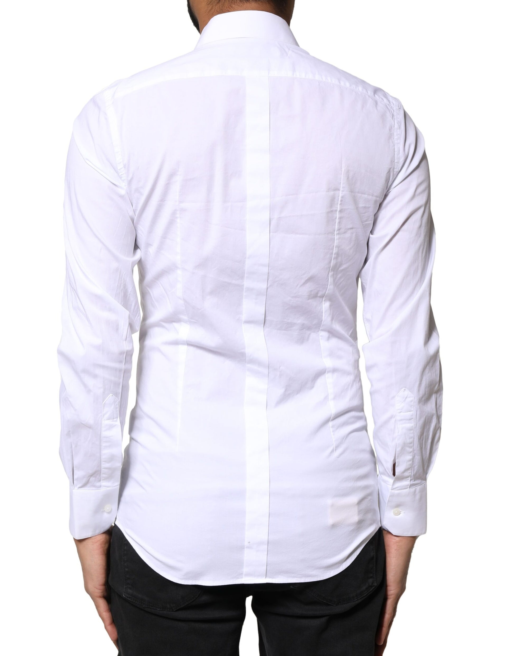 A white cotton dress shirt with long sleeves and gold accents from the brand Dolce & Gabbana
