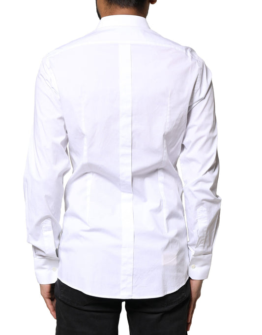A long sleeve white dress shirt with gold accents from the brand Dolce & Gabbana
