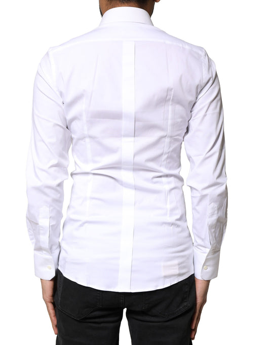 A white cotton dress shirt with gold accents, long sleeves and a collar
