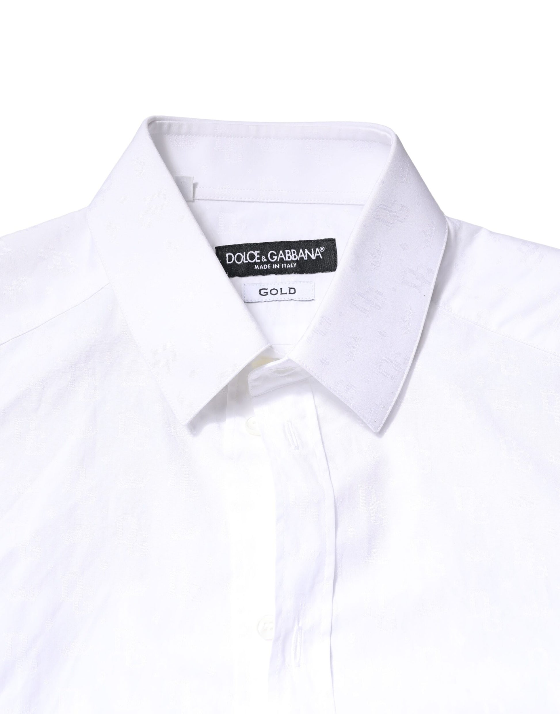 A white cotton long sleeve dress shirt with a gold label on the collar
