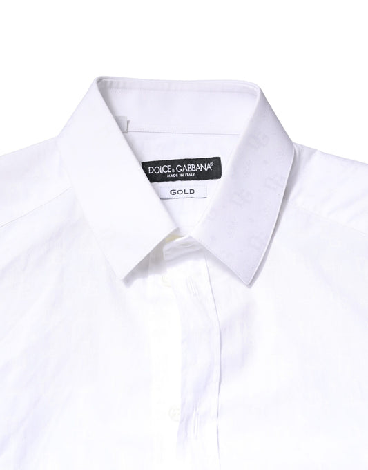 A white cotton long sleeve dress shirt with a gold label on the collar