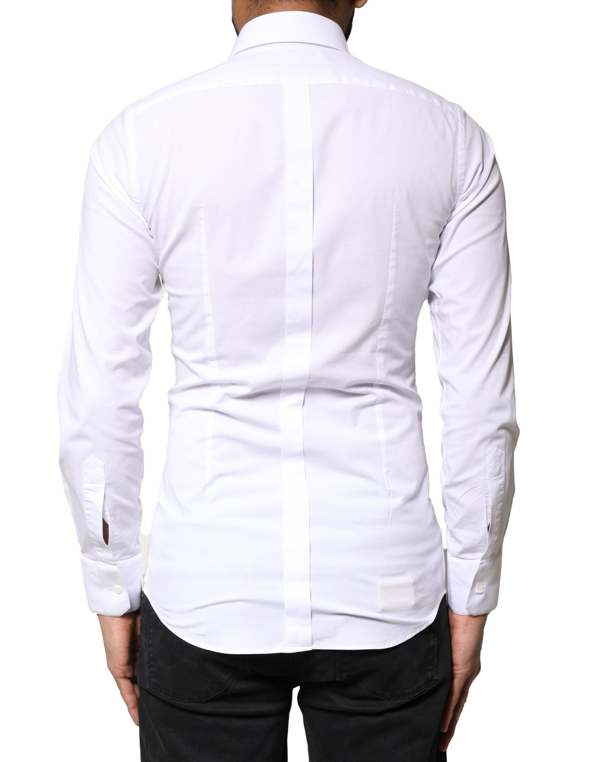 A white dress shirt with gold accents, long sleeves, and a collar. It is designed by Dolce & Gabbana and made