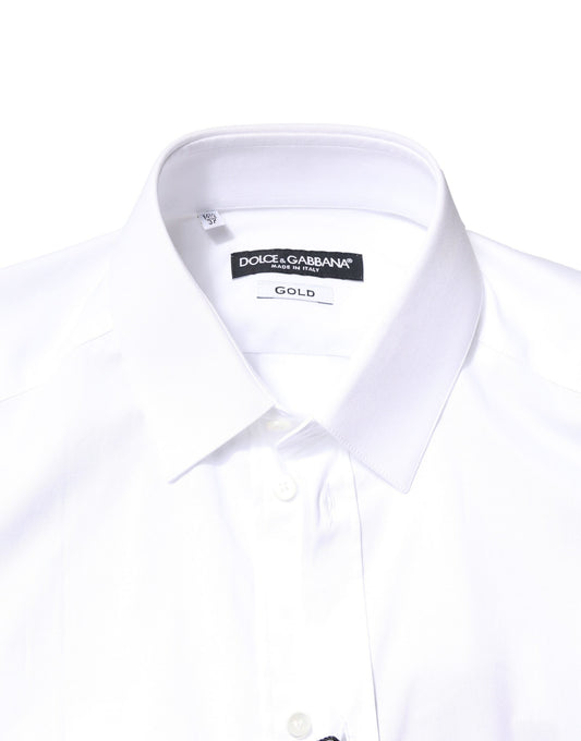 A white cotton dress shirt with long sleeves, featuring a gold label