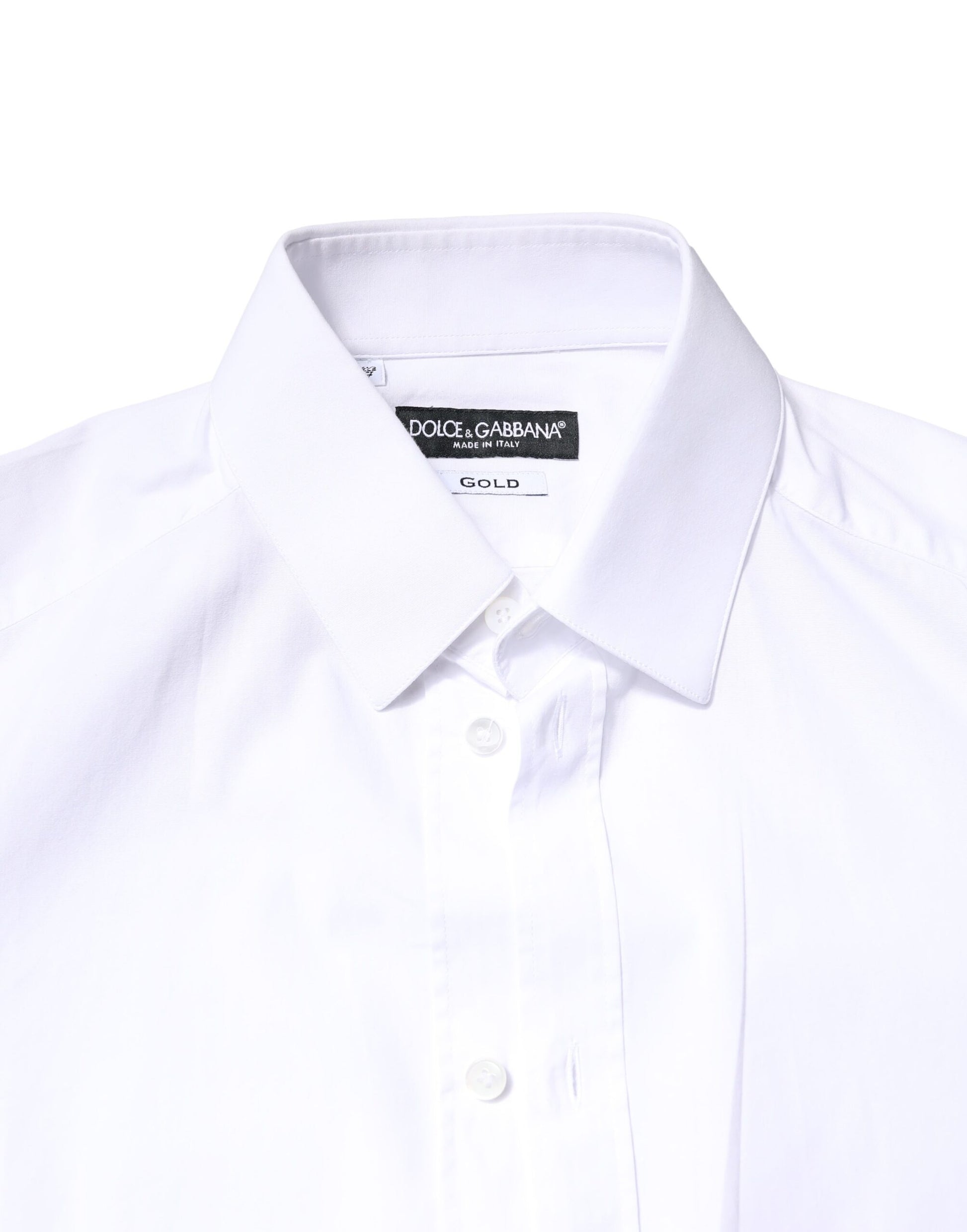 A white cotton dress shirt with long sleeves and gold accents from the brand Dolce & Gabbana