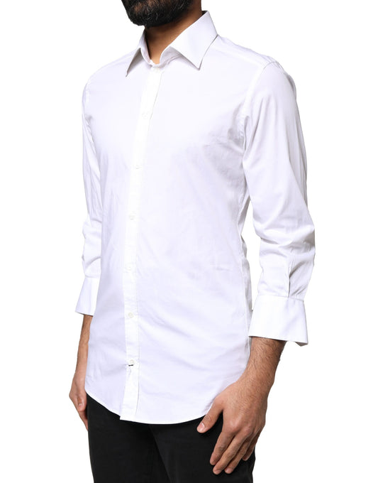 A white long-sleeved dress shirt with gold accents