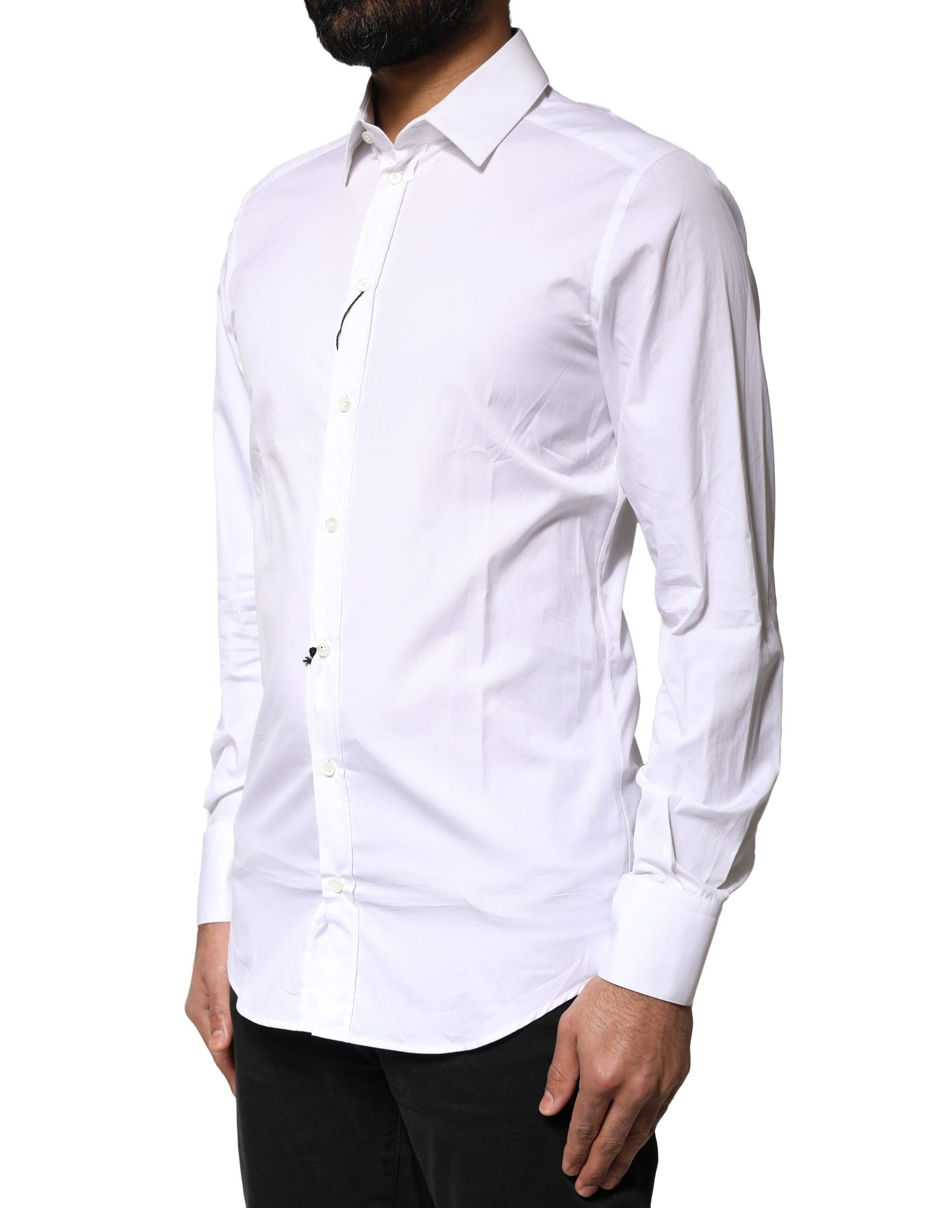 A white cotton long sleeve dress shirt with a gold design on the front