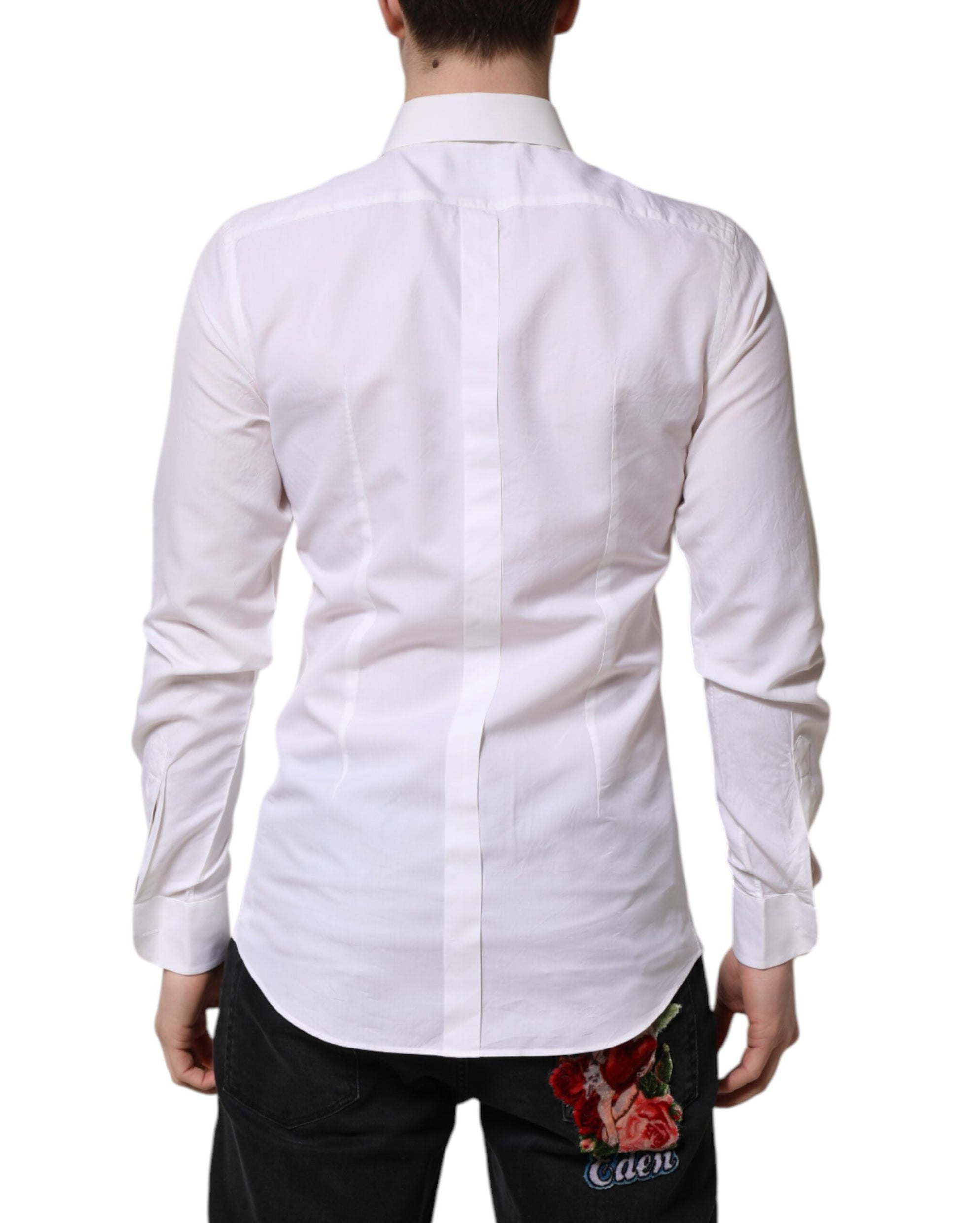 A white cotton poplin dress shirt with gold accents and a floral embroidery on the back
