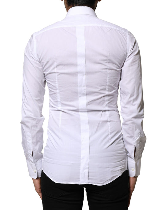 A white cotton dress shirt with gold accents from the brand Dolce & Gabbana