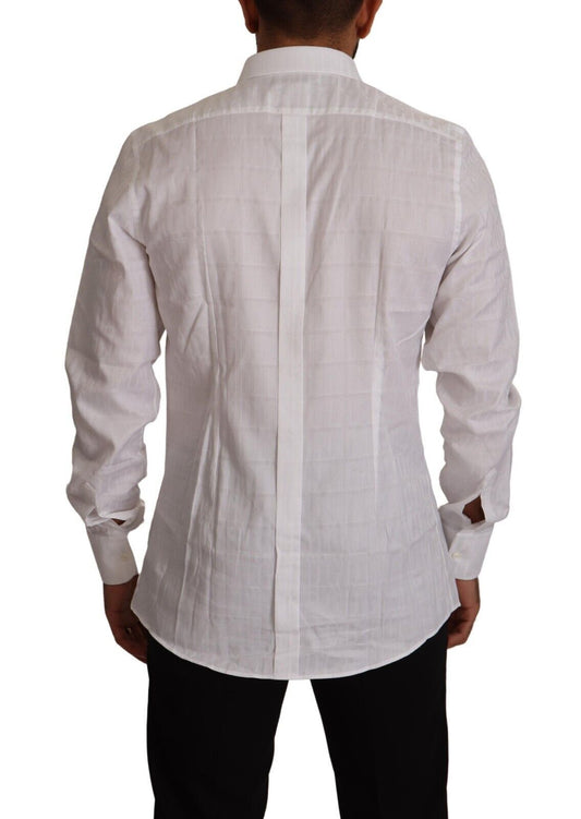 A white cotton dress shirt with a slim fit and gold accents