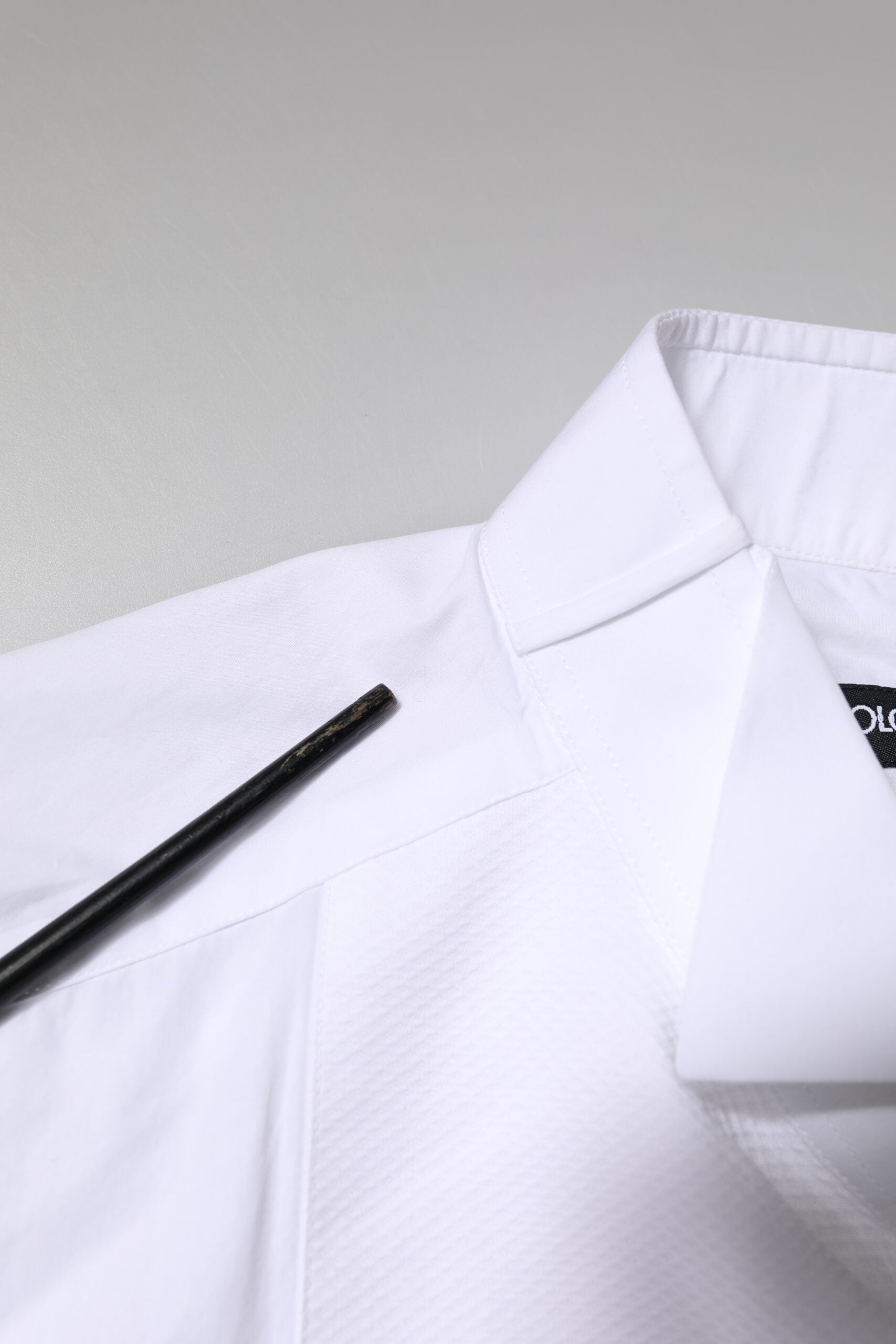 A white cotton poplin bib formal dress shirt with gold accents from Dolce & Gabbana