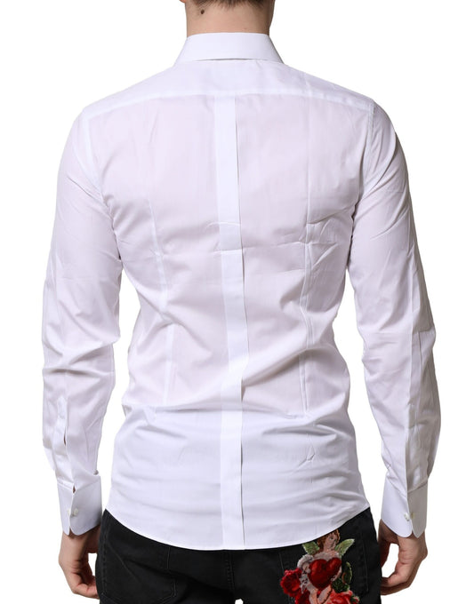 A white dress shirt with gold accents, featuring a crown logo on the left chest area