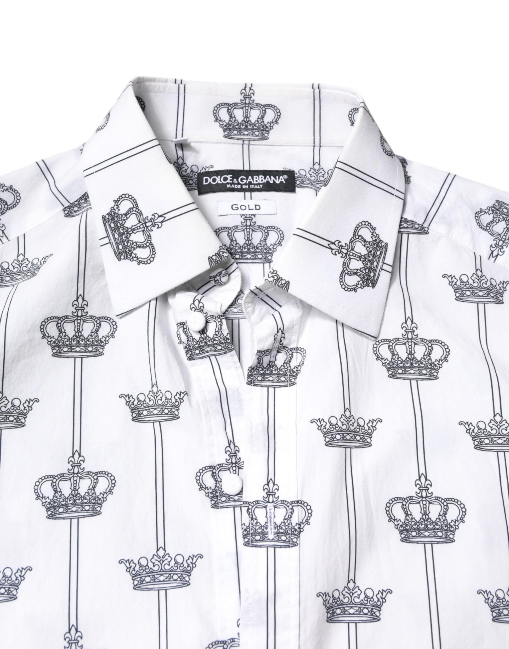 A white shirt with a pattern of gold crowns on it, designed by Dolce & Gabbana