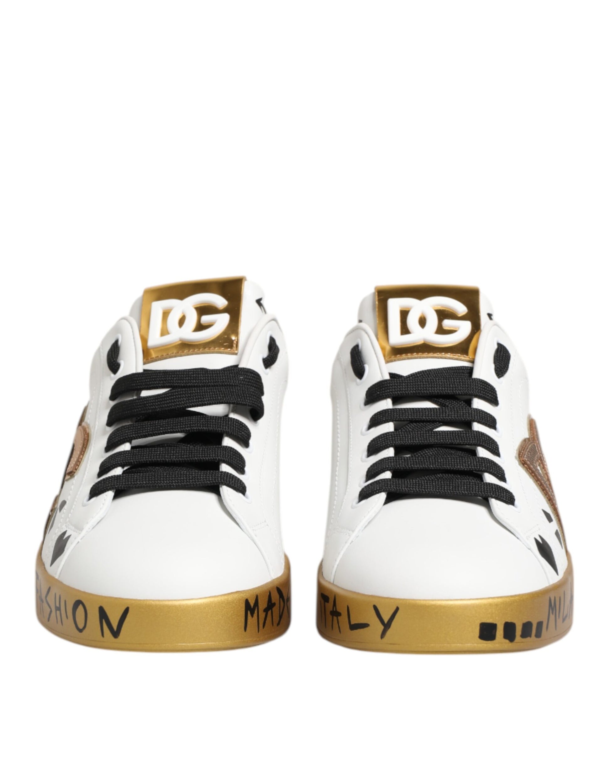Pair of white sneakers with gold accents