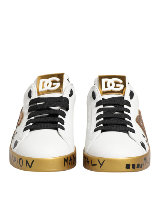 Pair of white sneakers with gold accents