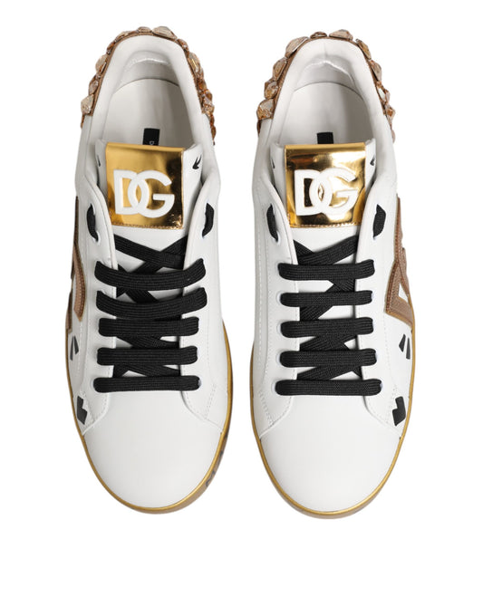 Pair of white sneakers with gold accents