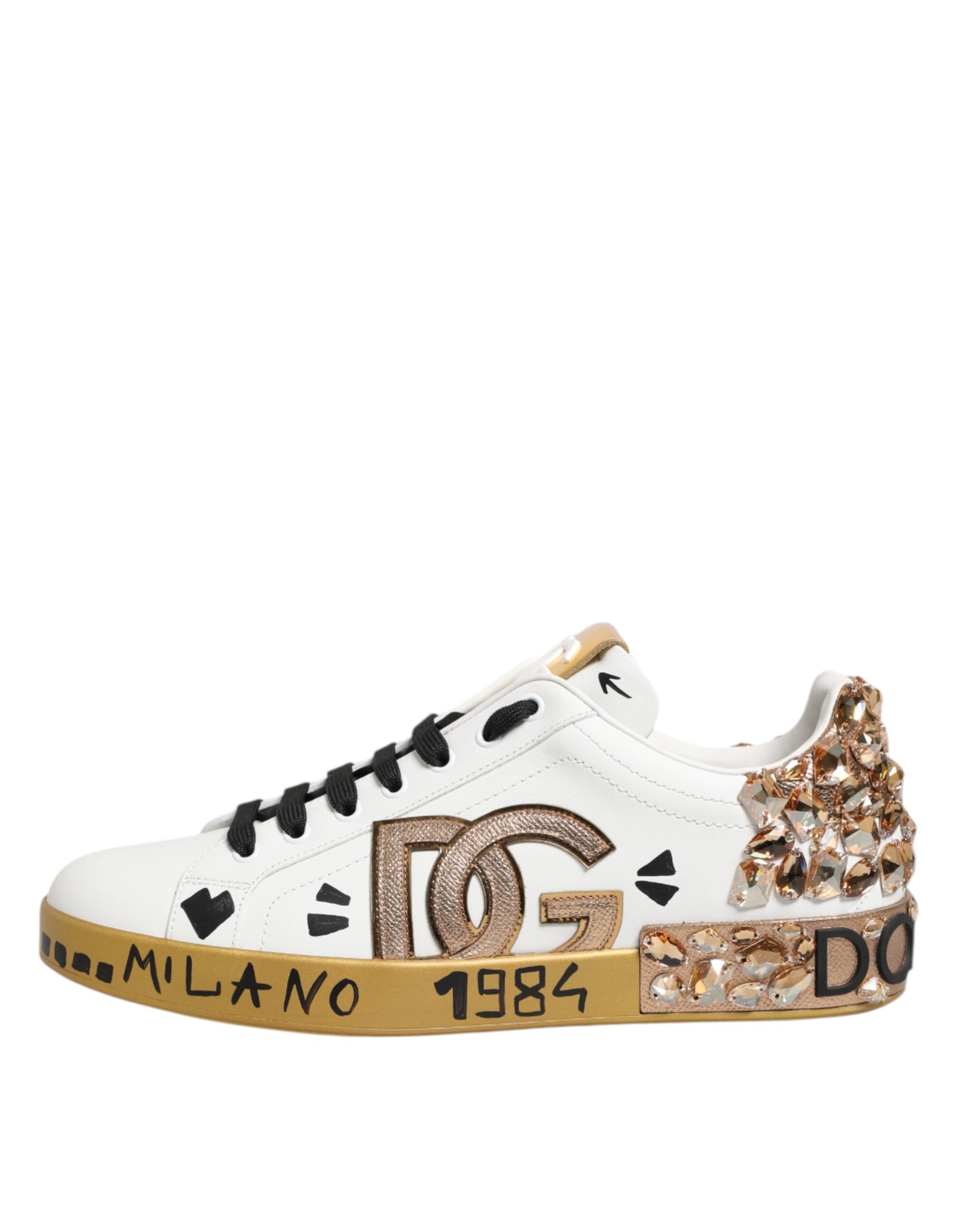 White sneaker with gold accents, featuring a heart design on the side