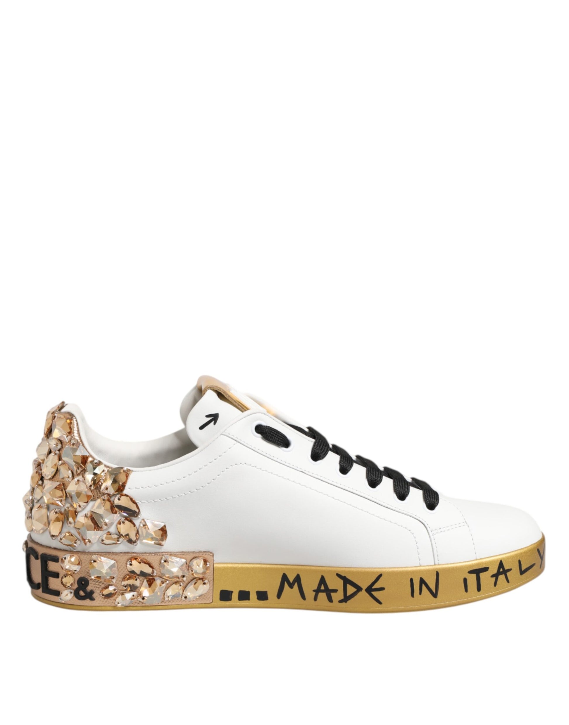White sneaker with gold accents and sparkly embellishments on heel