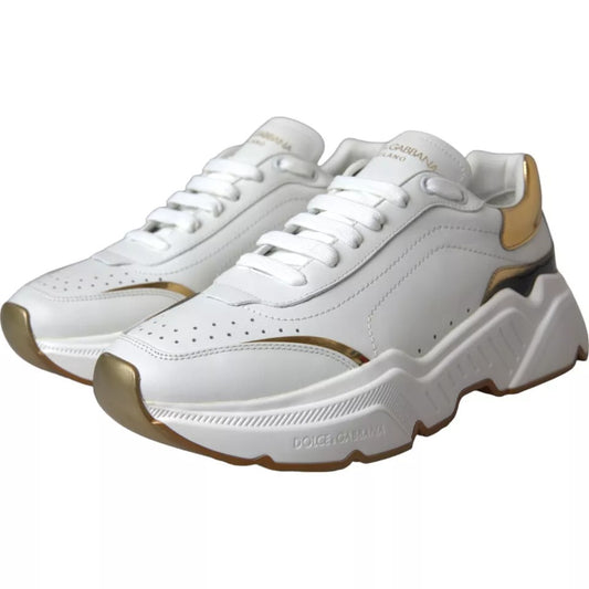 White sneakers with gold accents and white laces