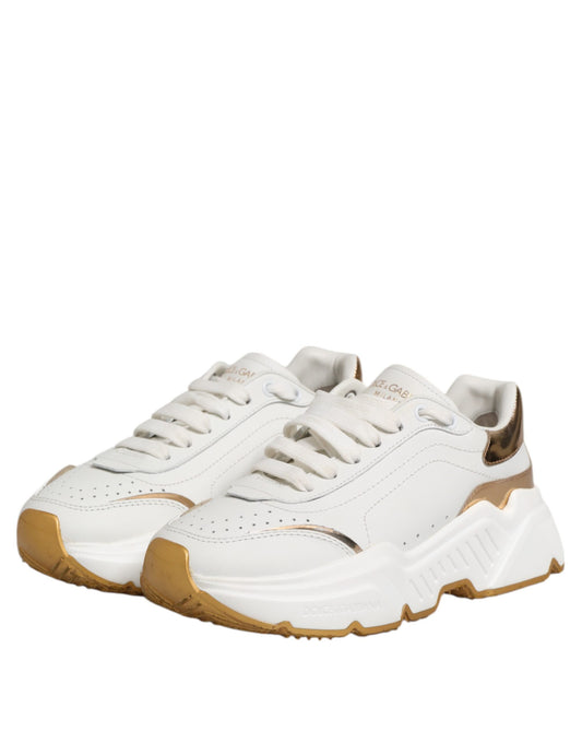 White gold leather sneakers with laces, featuring a low-top design