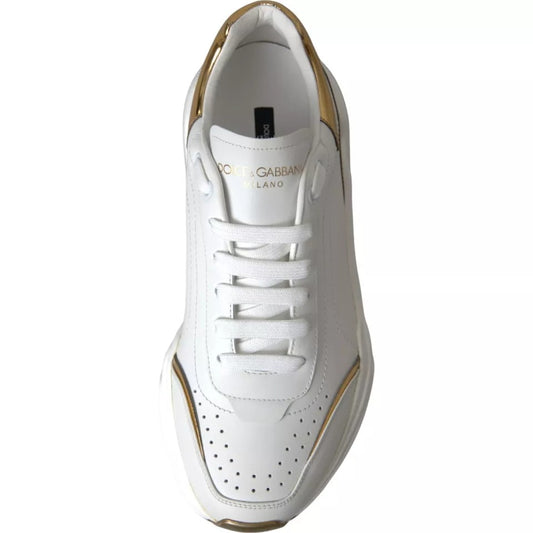 White sneaker with gold accents and logo on side