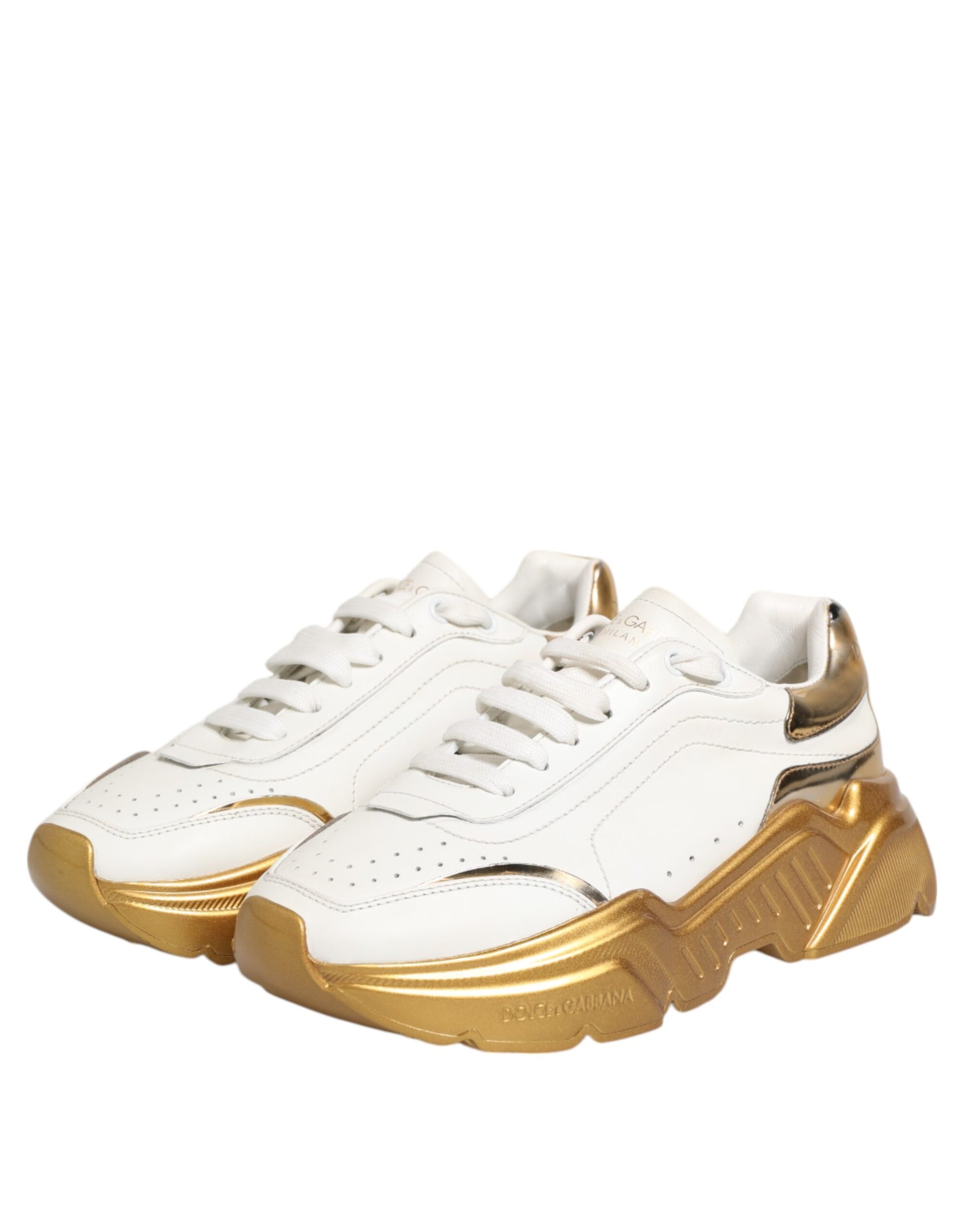 White gold leather sneakers with white soles, featuring a logo on the side