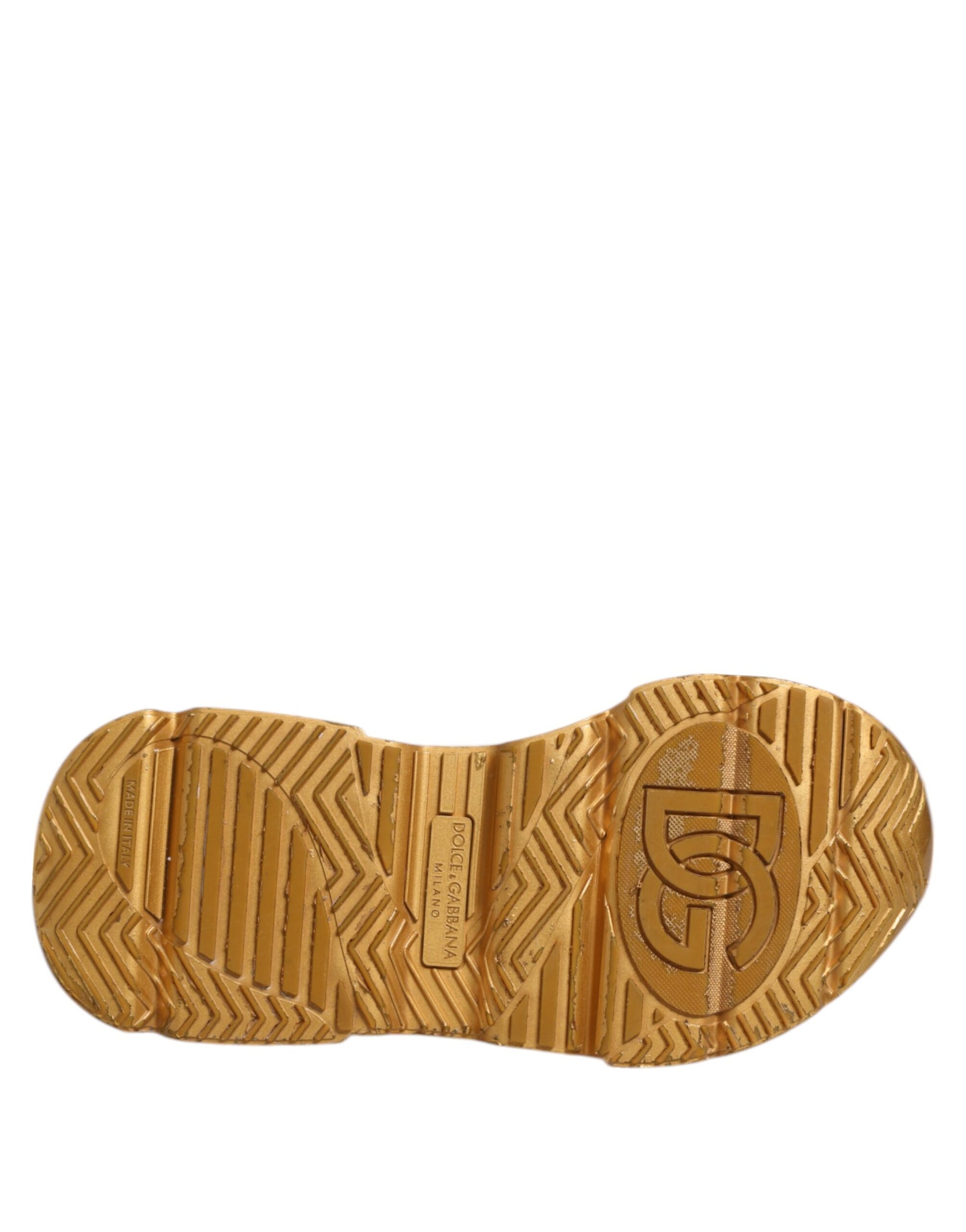 A pair of white gold leather sneakers with a logo on the side, featuring a textured design and a lace-up front