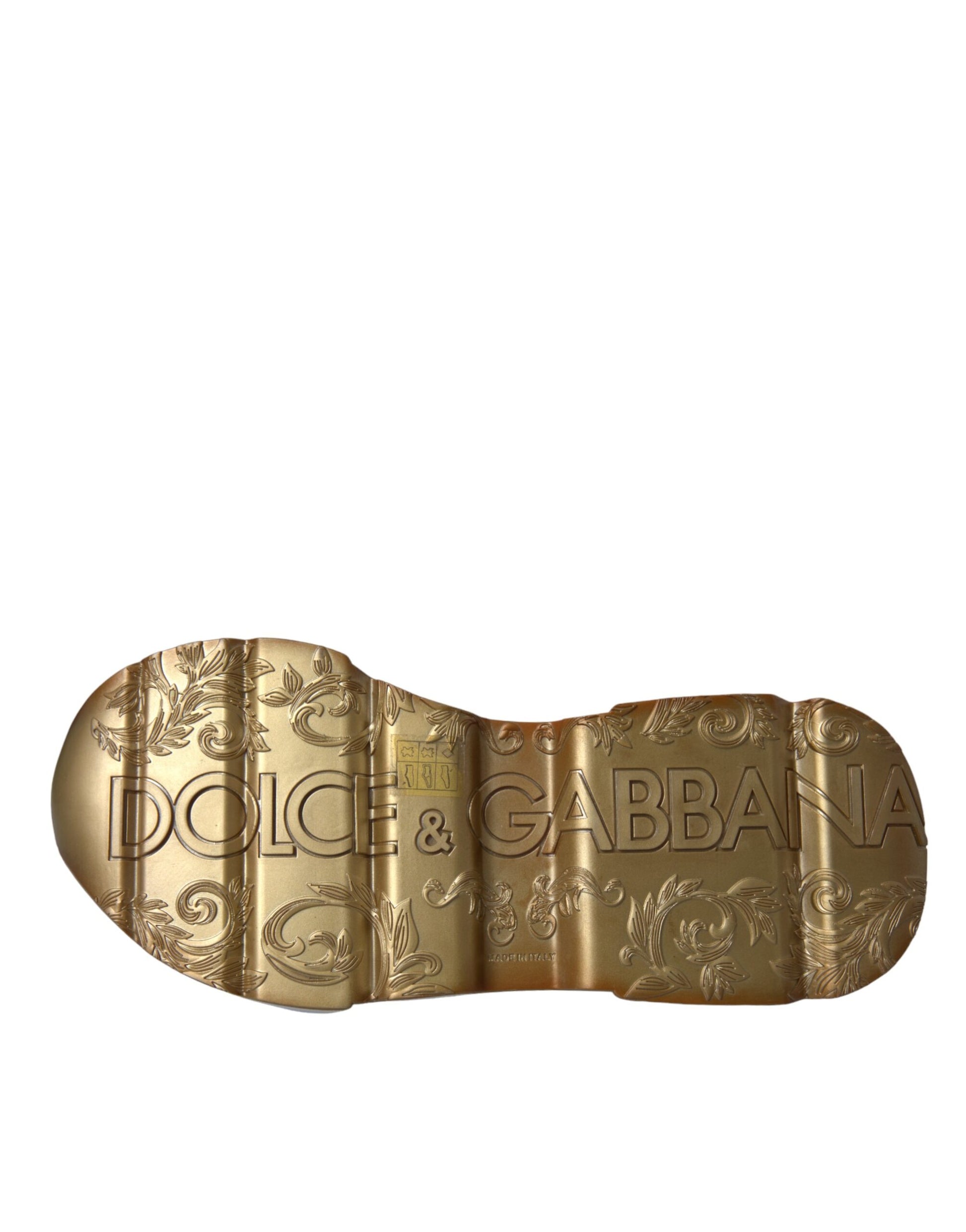 Gold shoe with intricate design and brand name