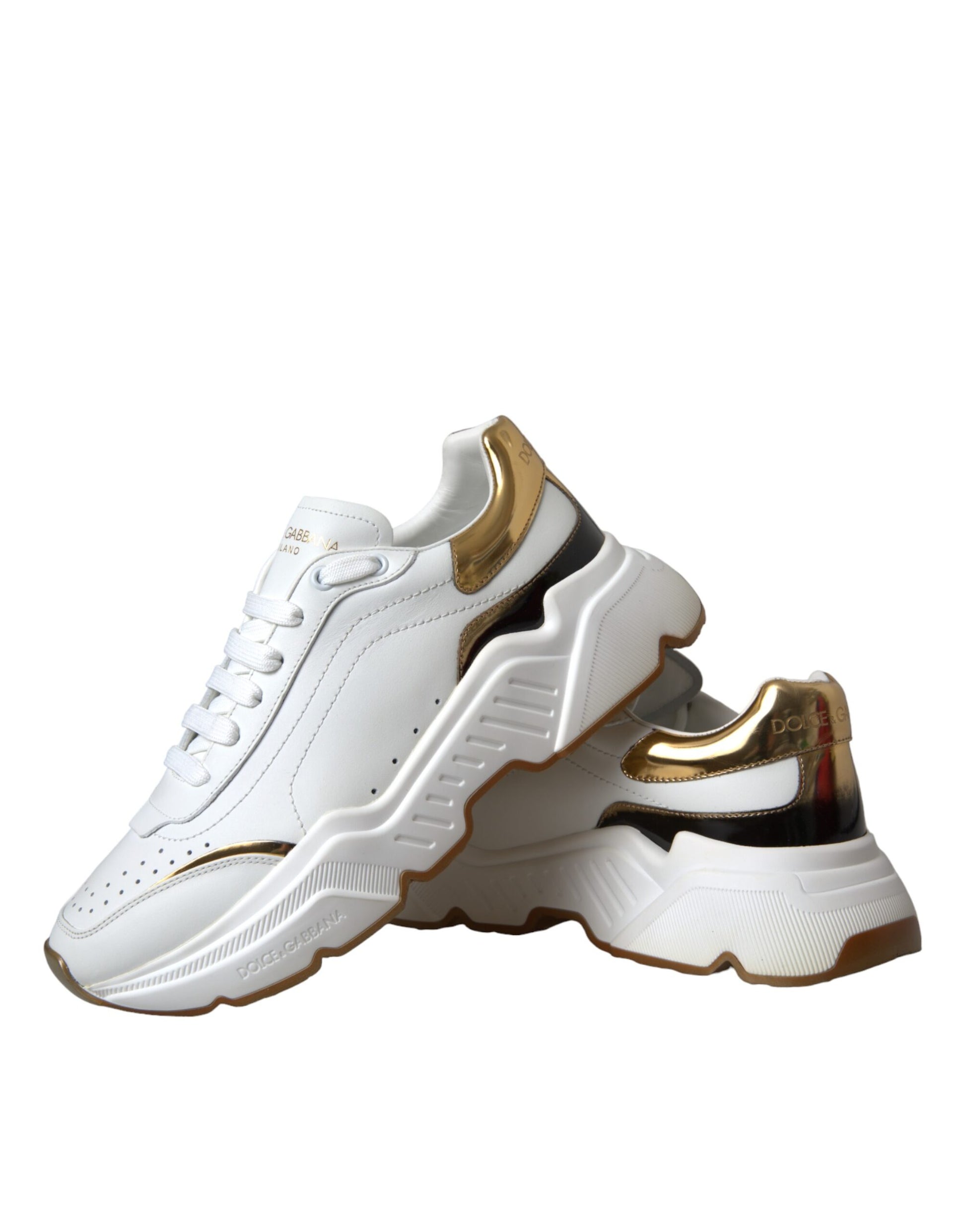 White sneaker with gold accents and a black sole