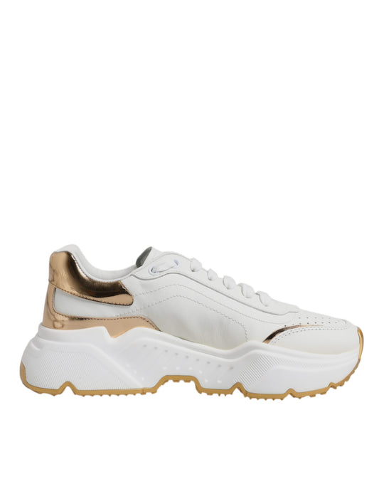 White sneaker with gold accents