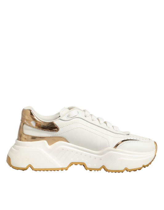 White sneaker with gold accents