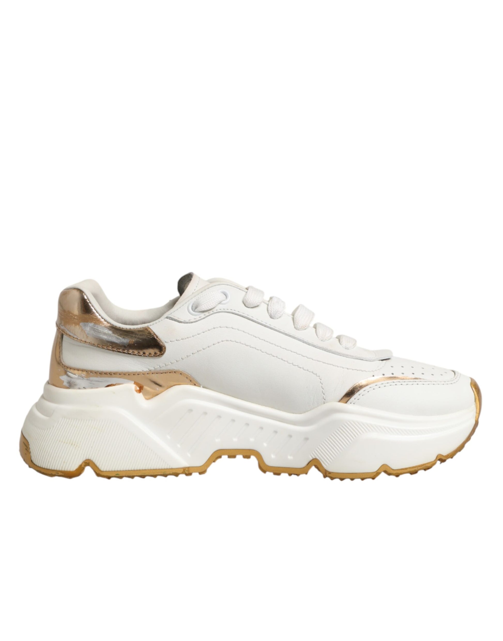 White gold sneakers with laces, featuring a low top and chunky sole design