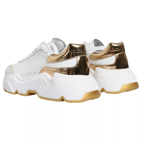 White sneakers with gold accents