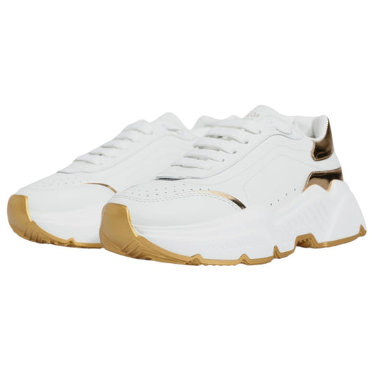White sneakers with gold accents