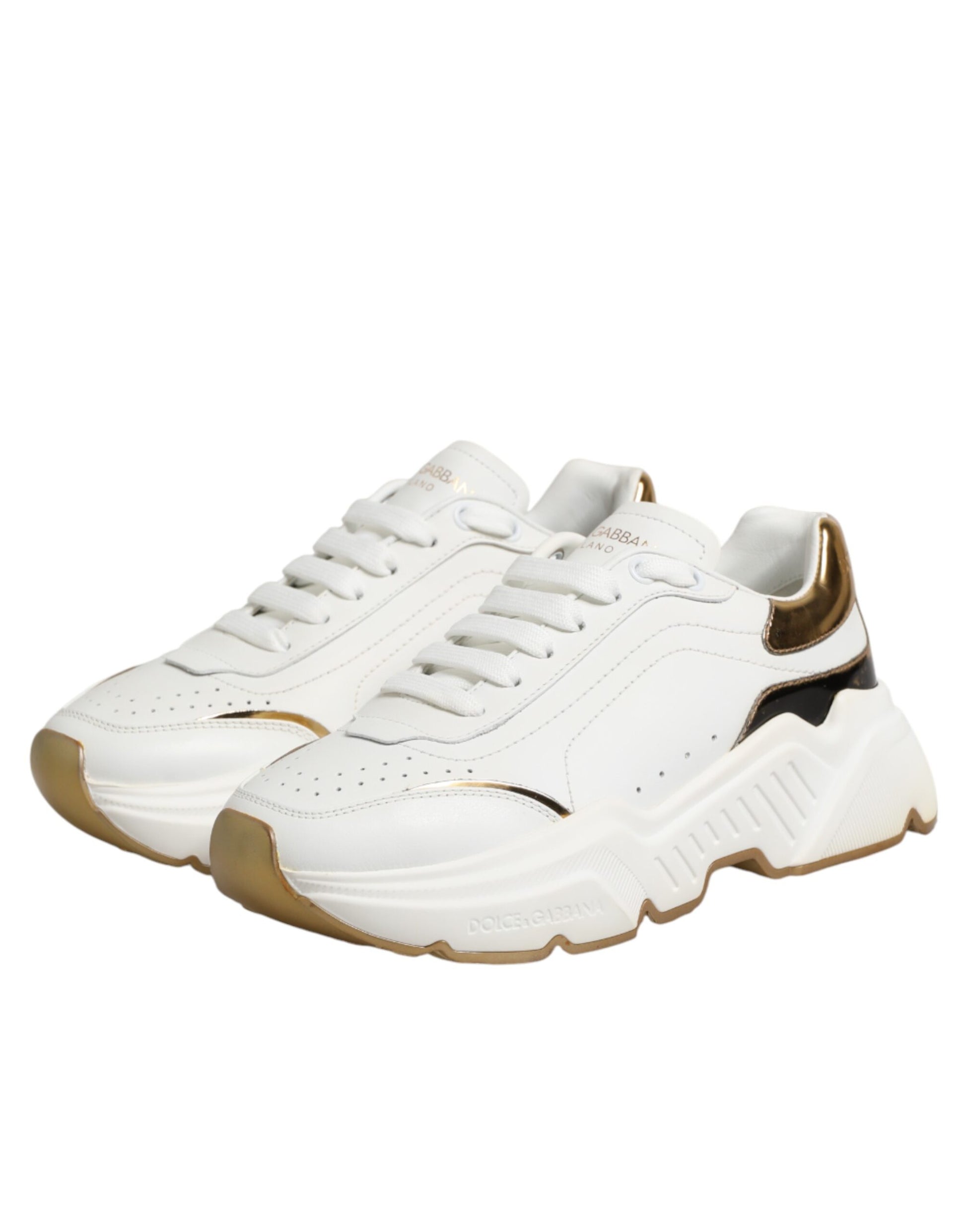 White gold sneakers with laces, featuring a low top design and a logo on the side