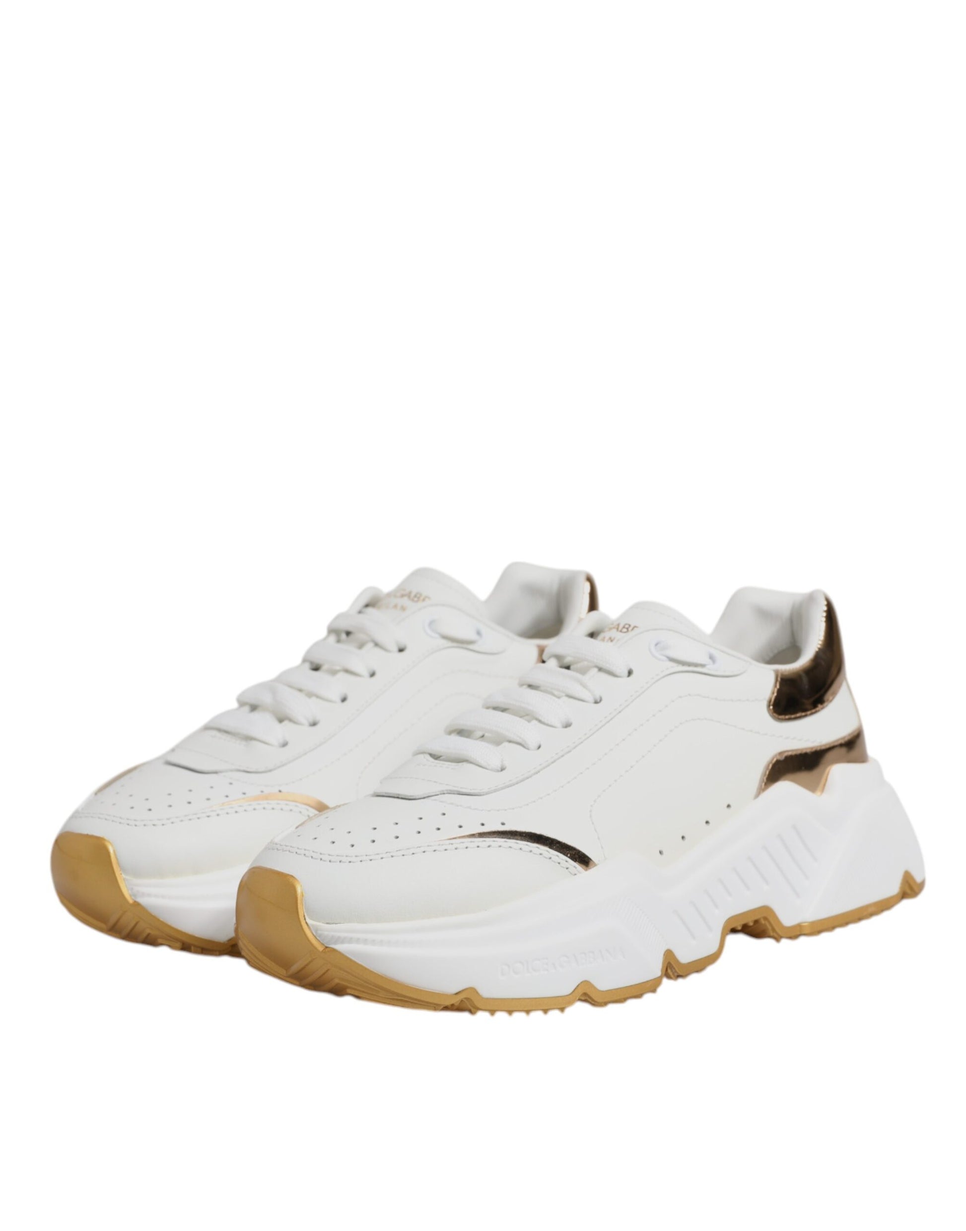 Pair of white sneakers with tan accents