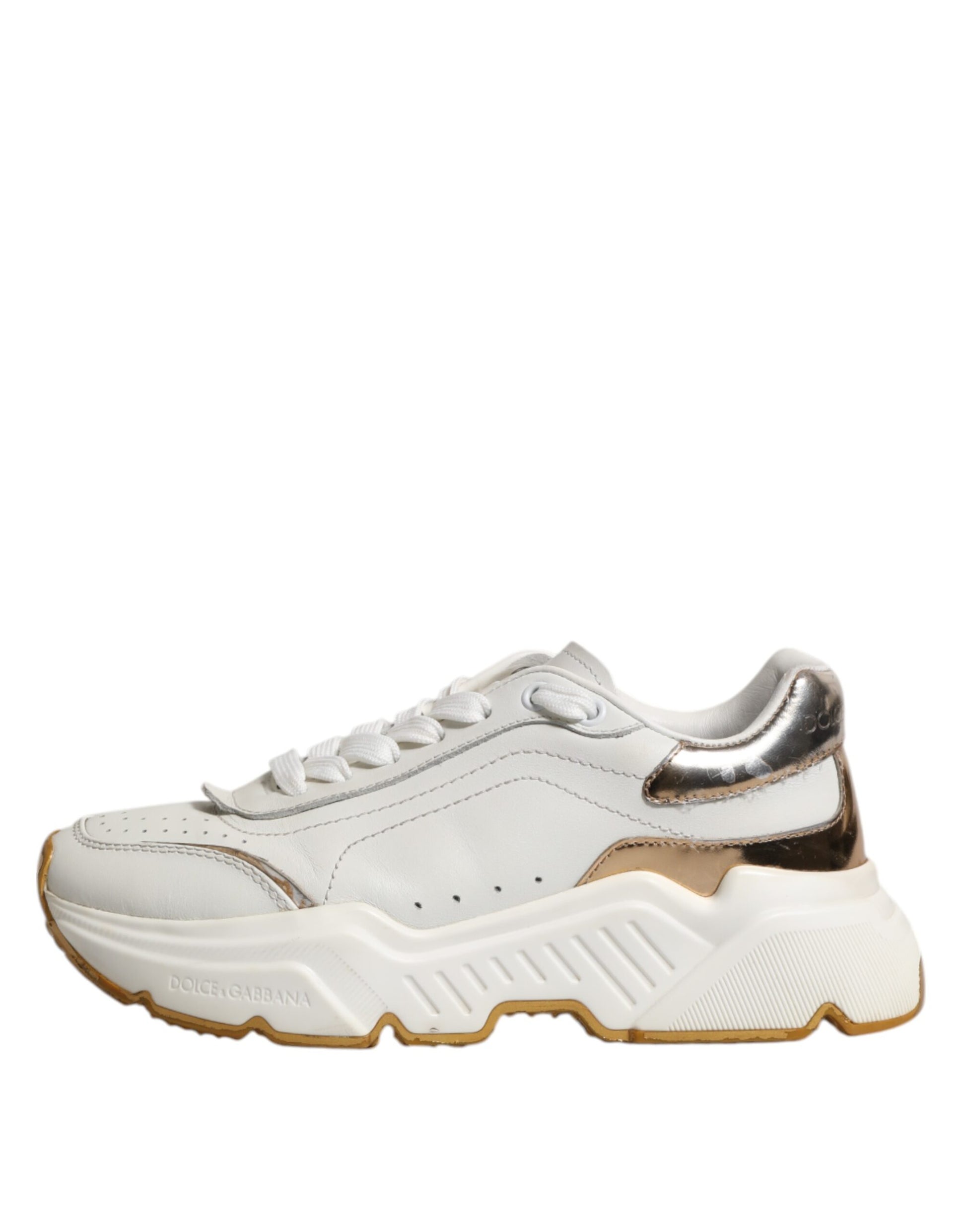 White gold sneakers with laces, featuring a low top and a chunky sole design