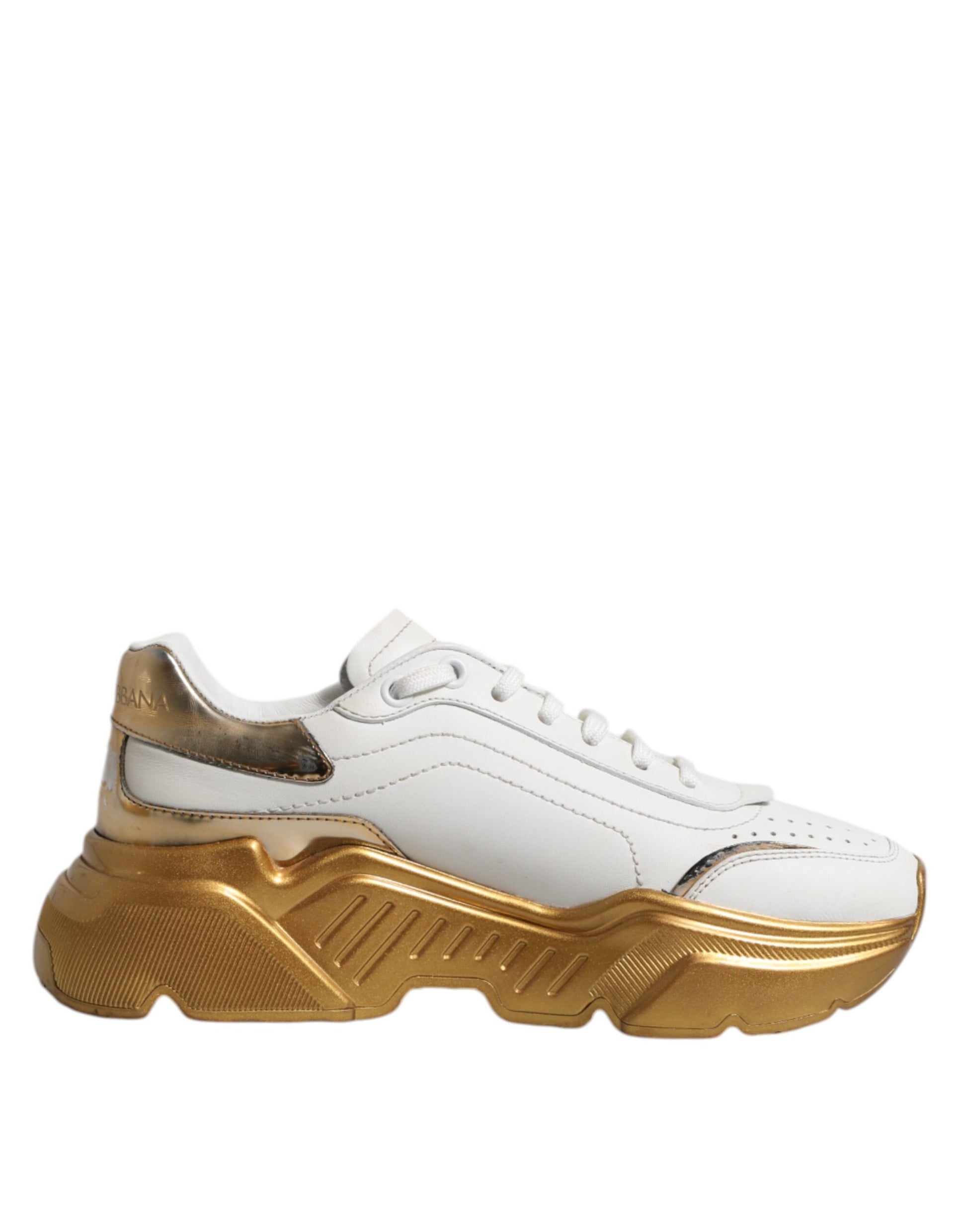 White gold sneakers with laces, featuring a low top design and a chunky sole